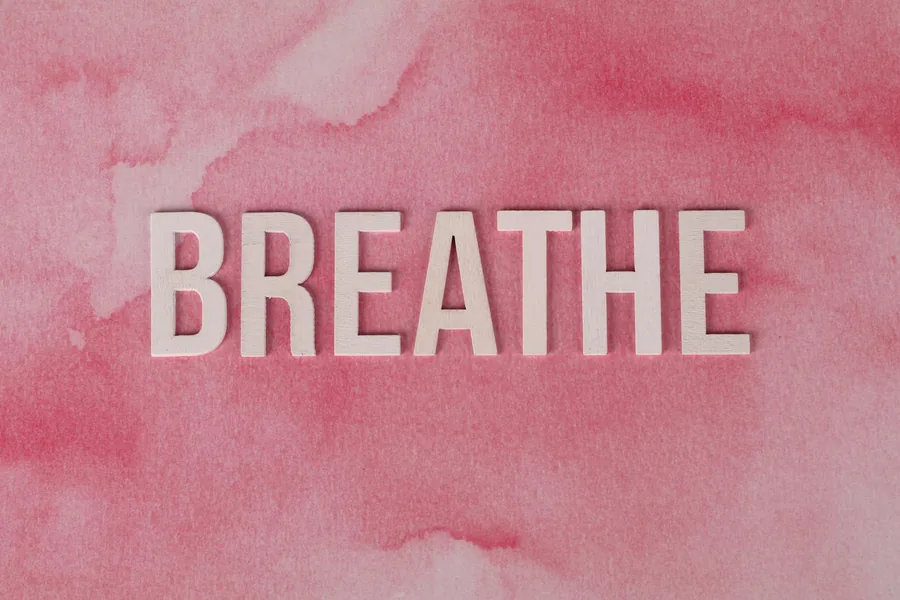 inspirational breathe on pink watercolor background